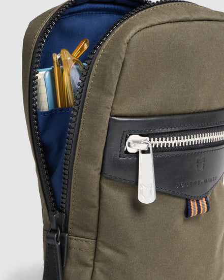 Journey Maker 9 Hour Sling Bag green cotton canvas detail view